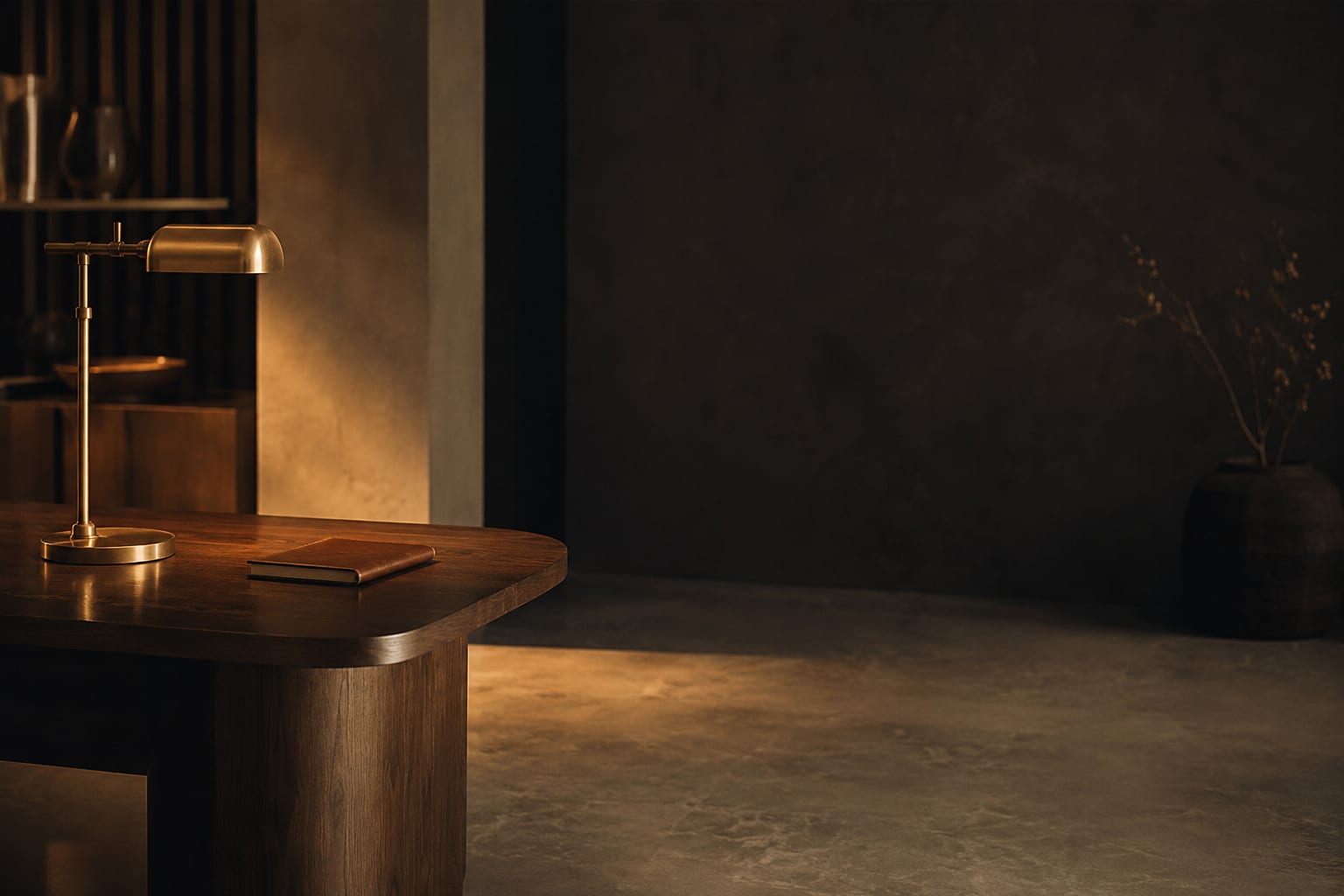 A quiet workspace lit by a brass desk lamp — the calm behind a brand that publishes on its own.